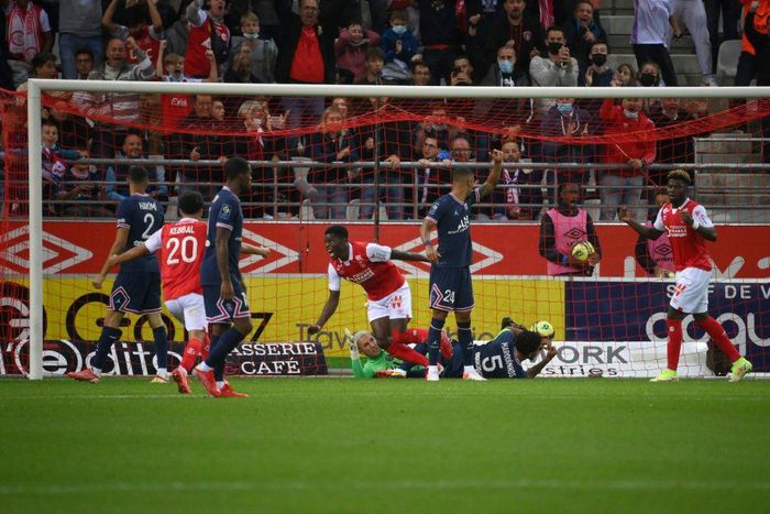 Zimbabwean Marshall Munetsi (C) celebrates after putting the ball in the net for Reims against Paris Saint-Germain, but the goal was disallowed for offside