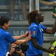 Moise Kean (R) celebrates his opening goal for Italy against Lithuania