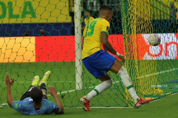 Raphinha (right) scored a brace on his first start for Brazil