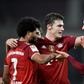 Serge Gnabry (L) and Robert Lewandowski (R) celebrate their goals with Bayern Munich team-mate Benjamin Pavard
