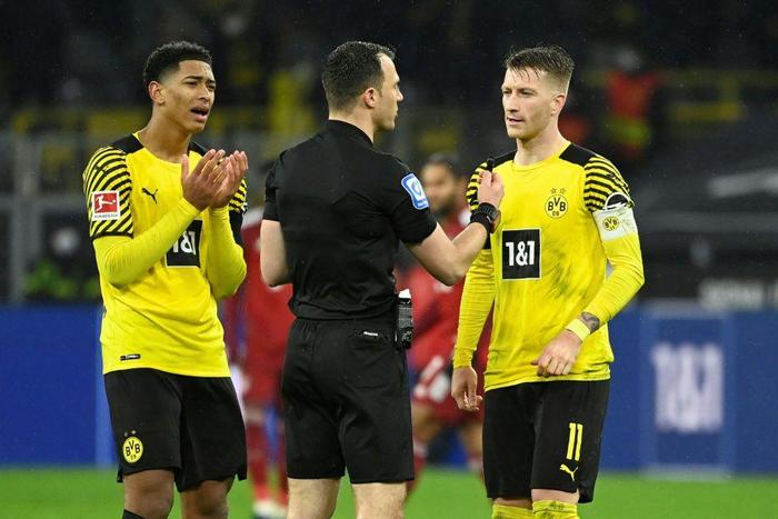 Jude Bellingham (L) could face sanctions from the German FA after criticising the referee following Saturday's 3-2 loss to Bayern Munich