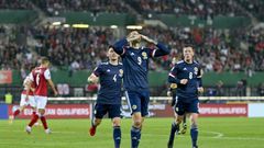 Spot on: Lyndon Dykes's penalty earned Scotland a crucial 1-0 win in Austria