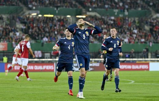 Spot on: Lyndon Dykes's penalty earned Scotland a crucial 1-0 win in Austria