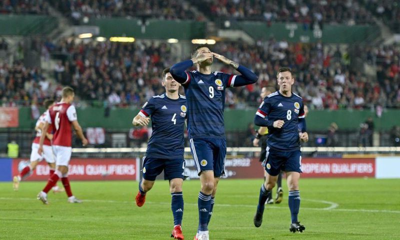 Spot on: Lyndon Dykes's penalty earned Scotland a crucial 1-0 win in Austria
