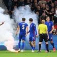 A flare is thrown onto the field during England's win over Hungary