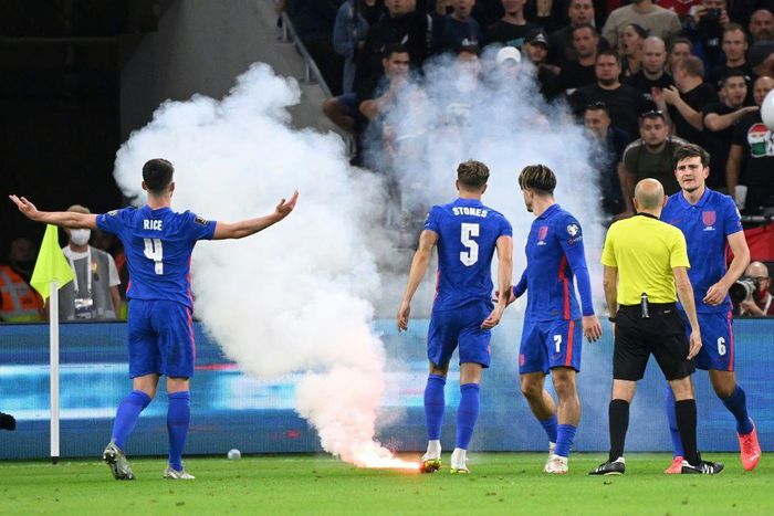A flare is thrown onto the field during England's win over Hungary