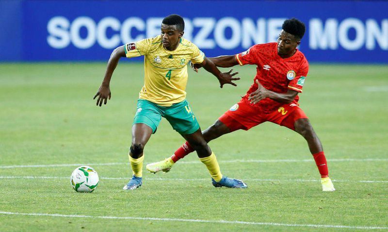 Teboho Mokoena (L) of South Africa and Suteman Hamid (R) of Ethiopia contest possession during a World Cup qualifier in Johannesburg on Tuesday.