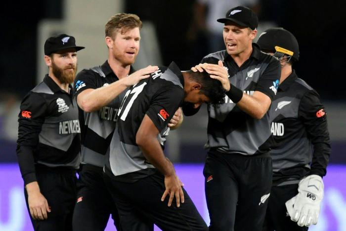 Big blow: New Zealand players celebrate the dismissal of India captain Virat Kohli in their T20 World Cup clash