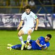 El Salvador's Ronald Rodríguez and USA's Brenden Aaronson contest a challenge in Thursday's World Cup qualifier