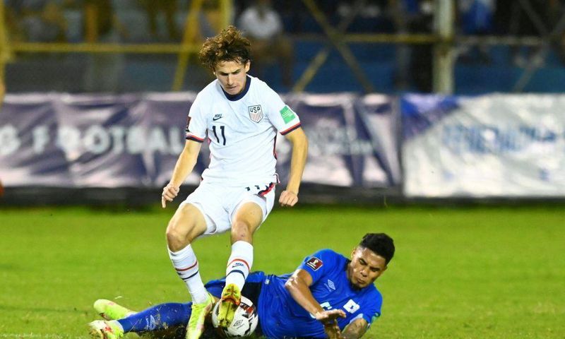 El Salvador's Ronald Rodríguez and USA's Brenden Aaronson contest a challenge in Thursday's World Cup qualifier