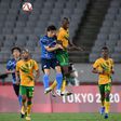 High life: Japan midfielder Ao Tanaka jumps for a header with South Africa's Evidence Makgopa