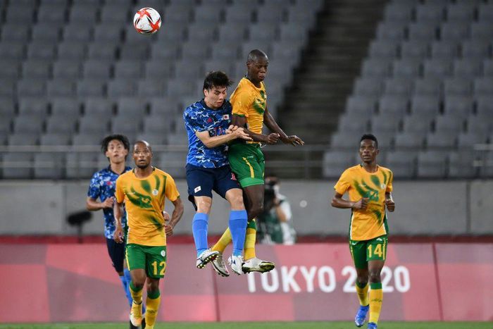 High life: Japan midfielder Ao Tanaka jumps for a header with South Africa's Evidence Makgopa