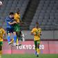 High life: Japan midfielder Ao Tanaka jumps for a header with South Africa's Evidence Makgopa
