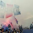 Paris Saint-Germain's Argentinian forward Lionel Messi salutes supporters gathered outside the Parc des Princes stadium