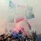Paris Saint-Germain's Argentinian forward Lionel Messi salutes supporters gathered outside the Parc des Princes stadium