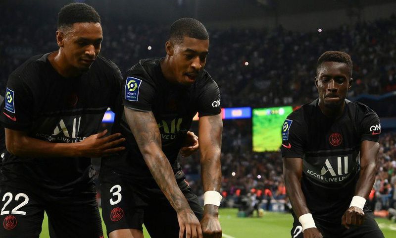 PSG players celebrate after Idrissa Gana Gueye (R) put them ahead against Montpellier
