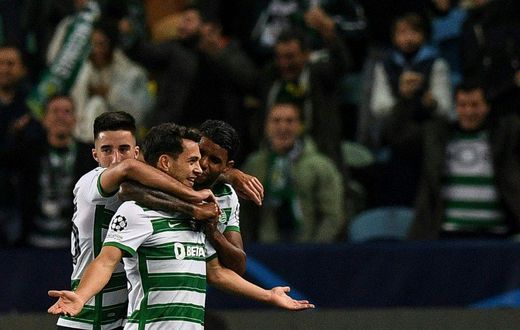 Pedro Goncalves (C) celebrates his two goals for Sporting Lisbon against Dortmund