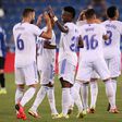 RReal Madrid's Brazilian forward Vinicius celebrates with teammates after netting in his side's opening day 4-1 thrashing of Alaves