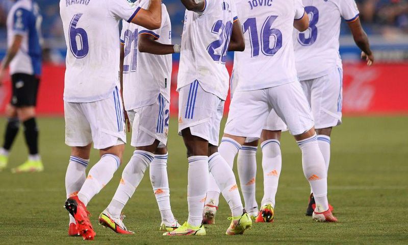 RReal Madrid's Brazilian forward Vinicius celebrates with teammates after netting in his side's opening day 4-1 thrashing of Alaves