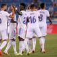 RReal Madrid's Brazilian forward Vinicius celebrates with teammates after netting in his side's opening day 4-1 thrashing of Alaves