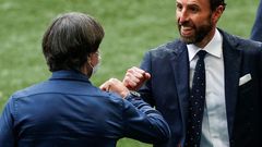 England coach Gareth Southgate (R) greets Germany boss Joachim Loew