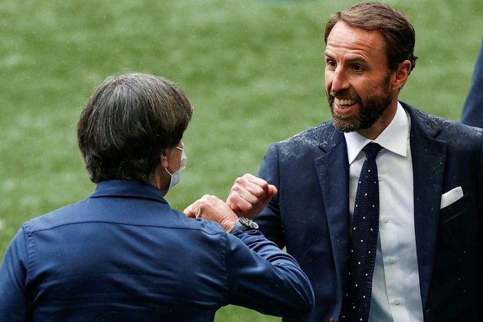 England coach Gareth Southgate (R) greets Germany boss Joachim Loew