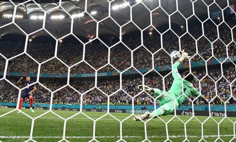 Switzerland goalkeeper Yann Sommer saves Kylian Mbappe's penalty in their last-16 shootout win over France