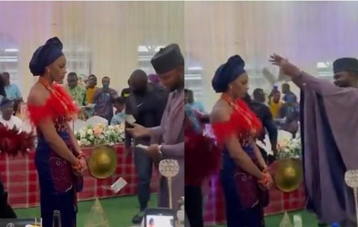 Bride refuses to smile or dance as groom sprays cash on her but people say it’s a tradition (video)