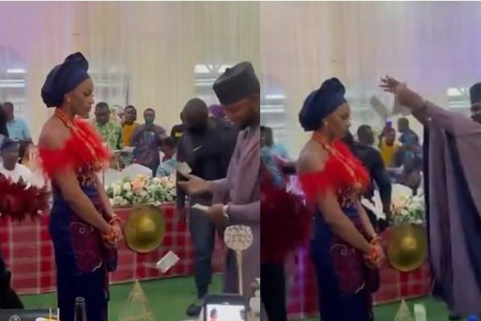 Bride refuses to smile or dance as groom sprays cash on her but people say it’s a tradition (video)