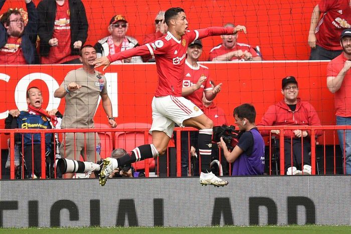Cristiano Ronaldo leaps in celebration after scoring on his return to Manchester United