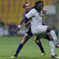 Bafetimbi Gomis holds of Esteghlal defender Siavash Yazdani