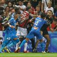 Flashpoint: Marseille's French midfielder Dimitri Payet (centre) reacts as players stop a fan  invading the pitch