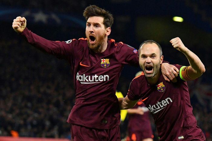 Team-mates: Lionel Messi and Andres Iniesta celebrate another Barcelona Champions League goal together at Stamford Bridge in 2018.