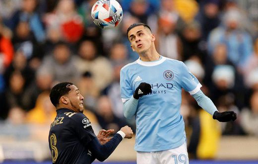 New York City FC's Jesus Medina, right, goes for a header against Philadelphia's Jose Andres Martinez in City's 2-1 victory over the Union to advance New York to the MLS Cup final