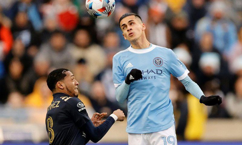 New York City FC's Jesus Medina, right, goes for a header against Philadelphia's Jose Andres Martinez in City's 2-1 victory over the Union to advance New York to the MLS Cup final
