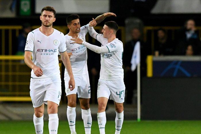 Joao Cancelo (C) celebrates scoring Manchester City's opener away to Club Brugge