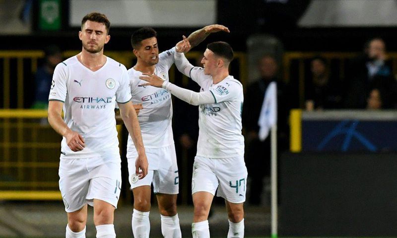 Joao Cancelo (C) celebrates scoring Manchester City's opener away to Club Brugge