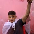 An England fan with smoke bomb outside Wembley