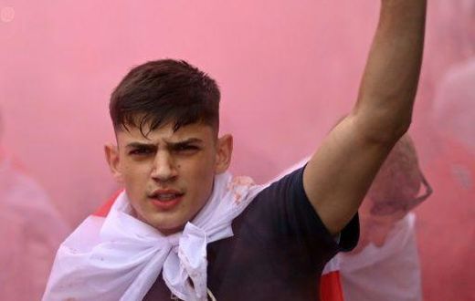 An England fan with smoke bomb outside Wembley