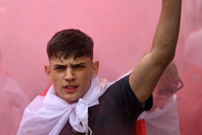 An England fan with smoke bomb outside Wembley