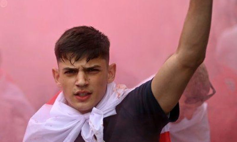 An England fan with smoke bomb outside Wembley