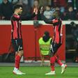 Bayer Leverkusen midfielders Nadiem Amiri (L) and Moussa Diaby (R) celebrate the winning goal over Celtic on Thursday