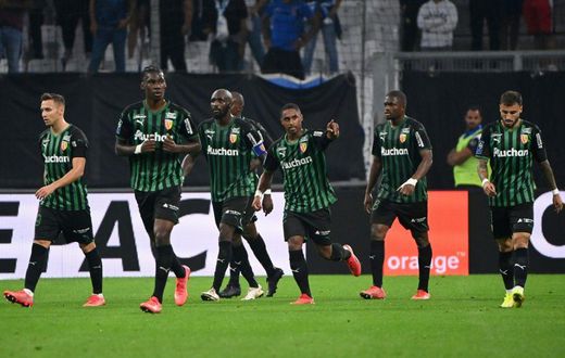Match winner: Wesley Said (centre) celebrates scoring Lens' third goal
