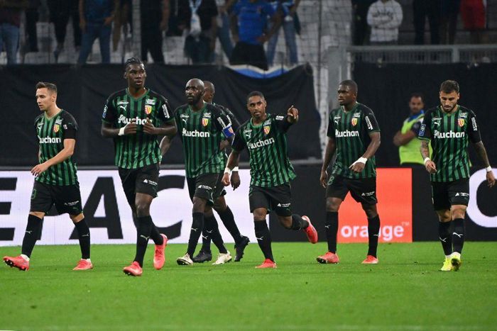 Match winner: Wesley Said (centre) celebrates scoring Lens' third goal