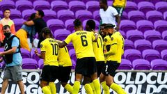 Jamaica's players celebrate a goal during their win over Suriname in the Gold Cup