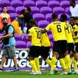 Jamaica's players celebrate a goal during their win over Suriname in the Gold Cup