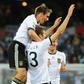 Mueller time: Thomas Mueller (centre) scored twice as Germany thumped England 4-1 at the 2010 World Cup