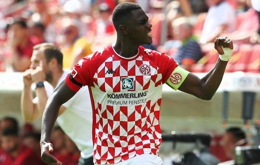 Mainz captain Moussa Niakhate celebrates scoring against Leipzig