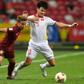 Thailand's Theerathon Bunmathan (left) fights for the ball with Vietnam's Ho Tan Tai during the second leg of the AFF Suzuki Cup semi-final