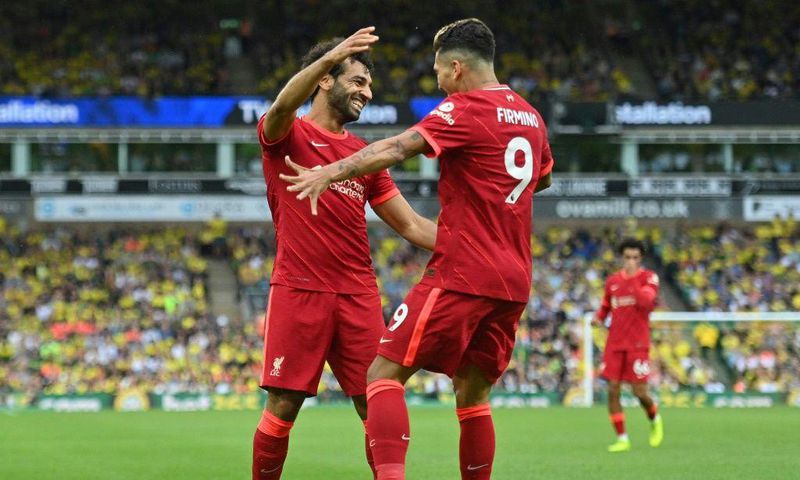 Mohamed Salah congratulates Roberto Firmino at Norwich on the opening day of the Premier League season